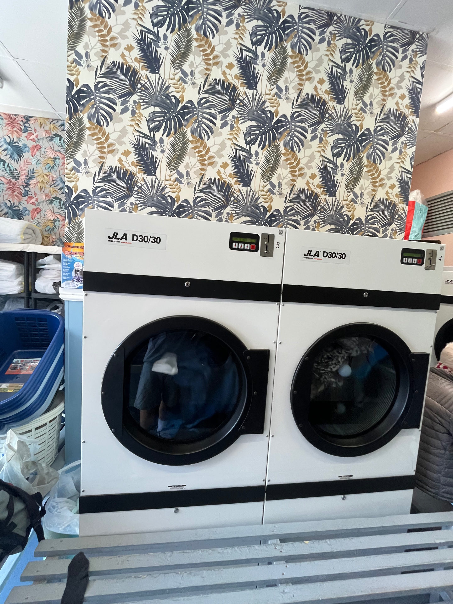 Two large JLA D30/30 commercial tumble dryers ready for duvets and bedding